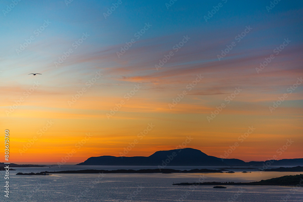 top view of a sunset over The city of Alesund and the sea during a sunny evening, Norway