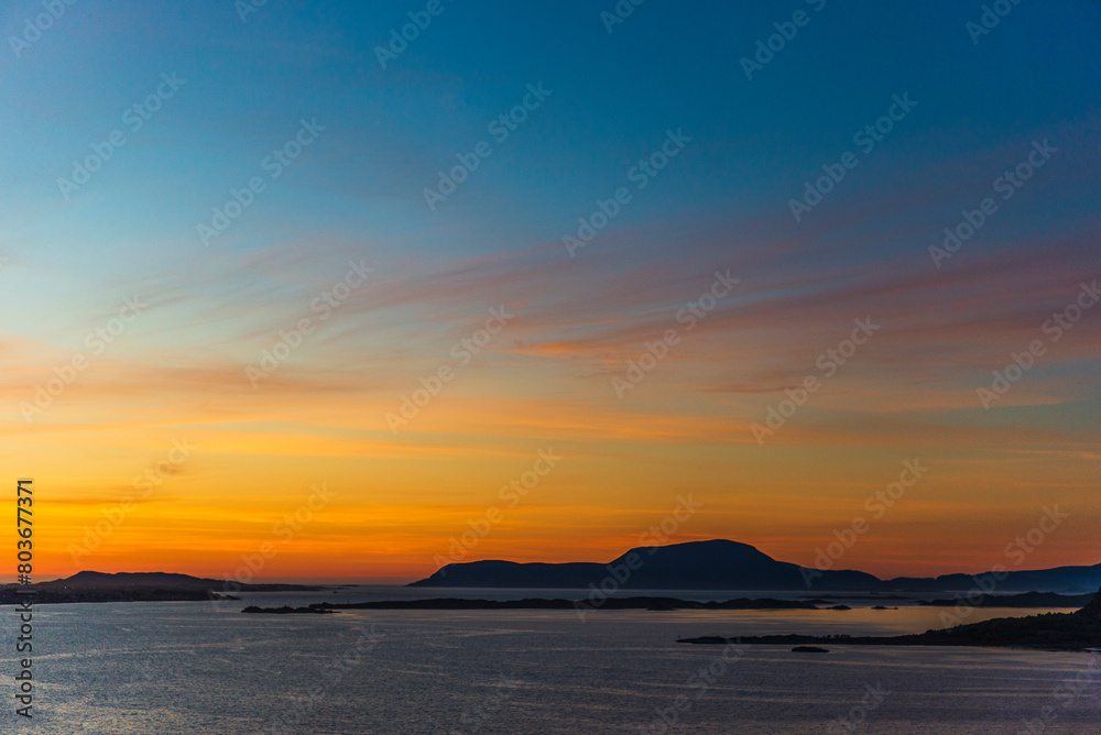 top view of a sunset over The city of Alesund and the sea during a sunny evening, Norway