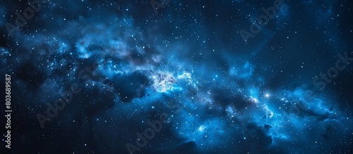 An astronomy-themed image featuring a stunning blue galaxy filled with glittering stars set against a dark black background