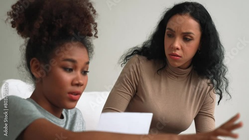 Stressed African American women has financial problems with credit card debt to pay crucial show concept of bad personal money and mortgage pay management crisis. photo