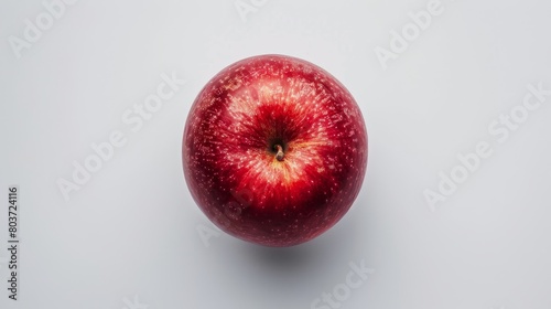 A red apple is shown in the center of the image