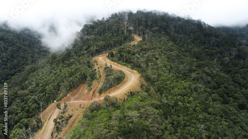 narrow and steep dirt road leading to the village on top of the mountain