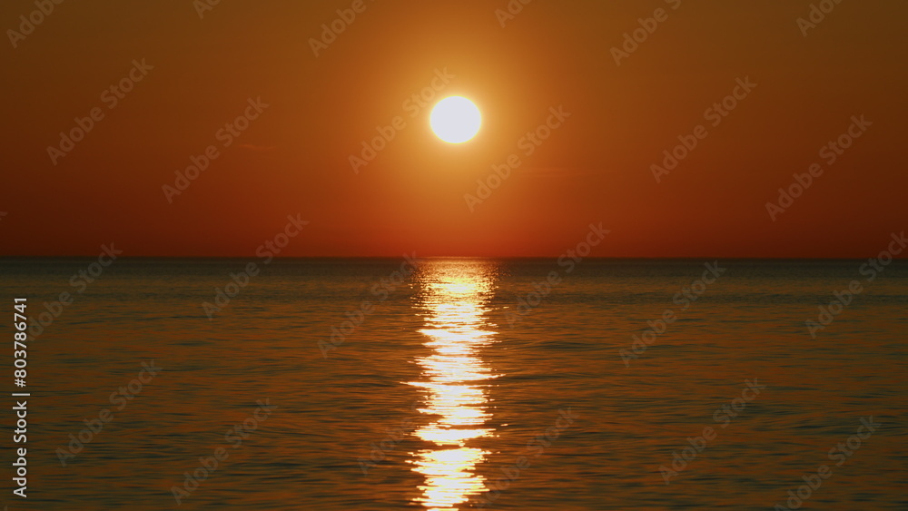 Sun Rises Above Sea. Abstract Summer Natural Background. Sunrise Over Calm Sea. Slow motion.