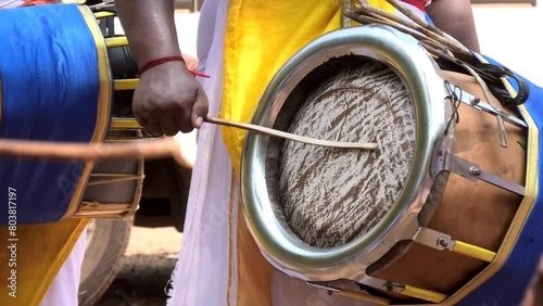 Artist playing Thavil, a South Indian percussion musical instrument	 photo