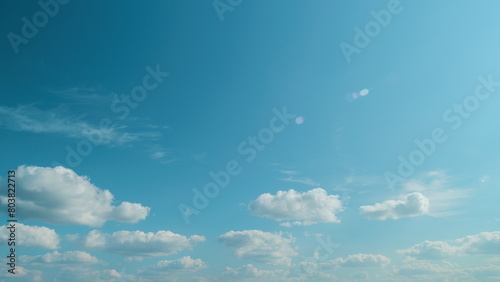 Flying Moving White Clouds In A Blue Sky. Blue Sky Background With Many Layers Tiny Clouds. photo