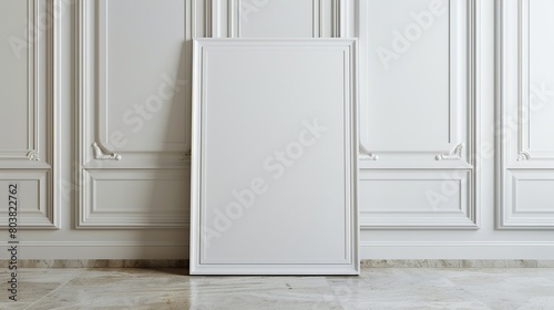Empty vertical white poster frame standing on light wooden floor with next to white wall.