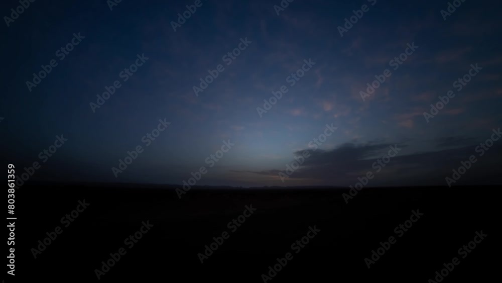 A sunrise timelapse of desert at Mhamid el Ghizlane in Morocco wide shot tilt A sunrise timelapse of desert at Mhamid el Ghizlane in Morocco wide shot tilt