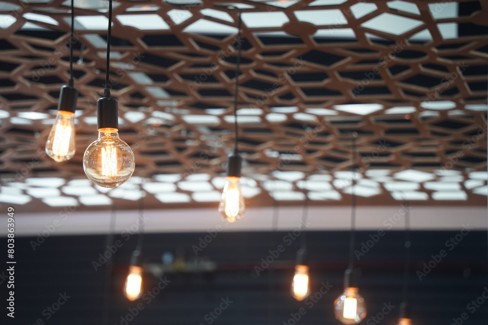 Obraz premium Electric light bulbs on wires. Loft style.