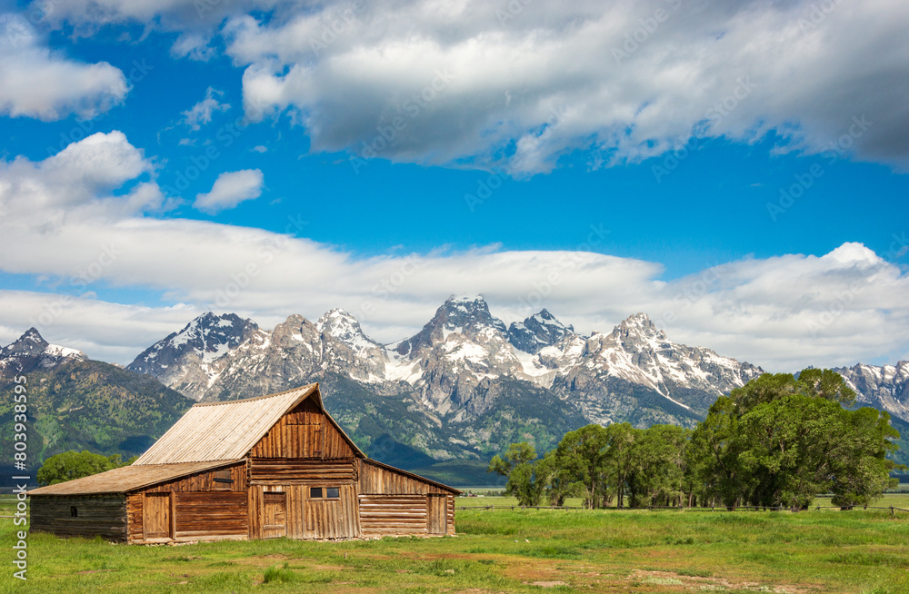 The John Moulton Barn and the Teton Range at Grand Teton National Park in Northwestern Wyoming The John Moulton Barn and the Teton Range at Grand Teton National Park in Northwestern Wyoming