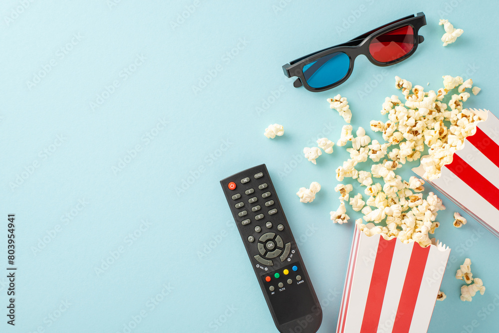 Elevate your movie night: top view of popcorn, 3D glasses, and streaming remote. Movie-themed decorations on a pastel blue backdrop, creating cozy atmosphere for unforgettable home cinema experience