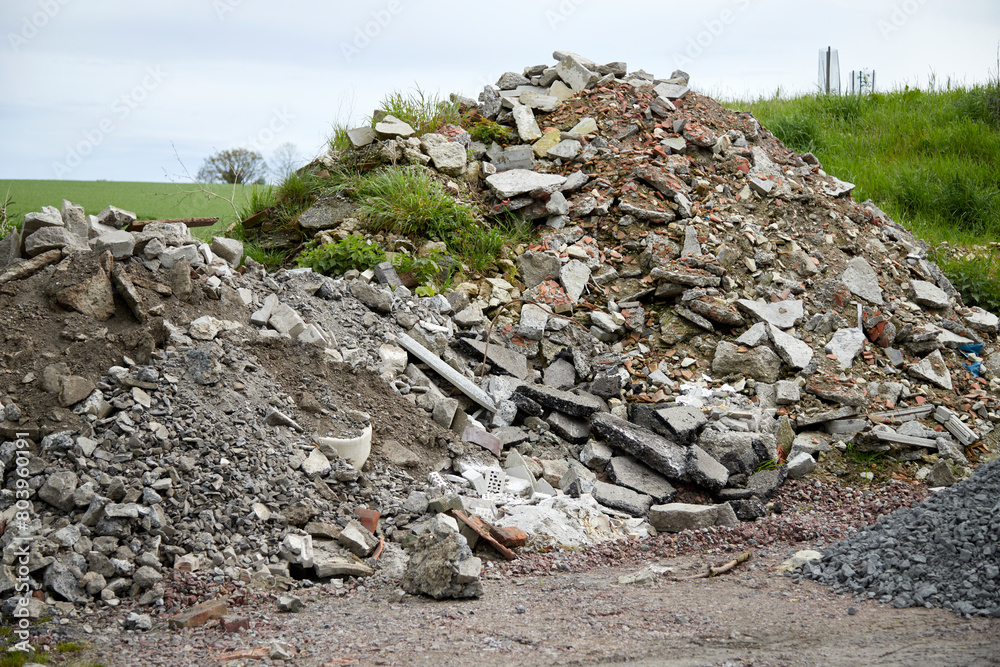 a large pile of building rubble with remains of stones and asphalt a large pile of building rubble with remains of stones and asphalt