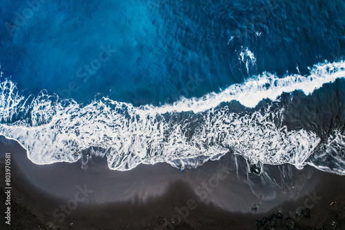 Aerial view of rough ocean with waves and volcanic beach, porto Moniz Madeira, Portugal