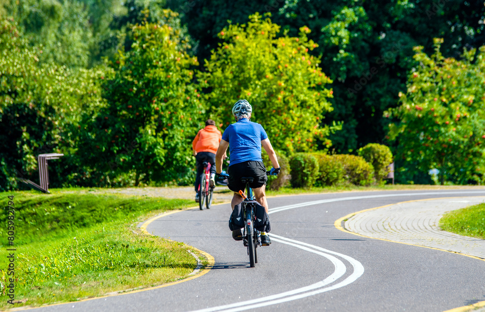 Cyclist ride on the bike path in the city Park