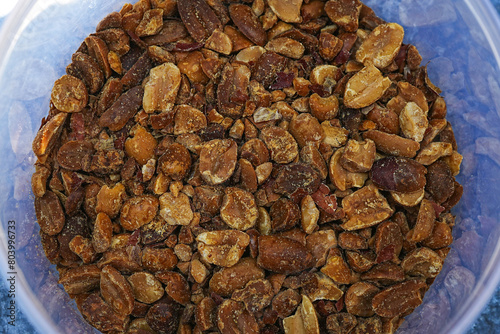 Peanuts are roasted, causing the seeds to be brown and black.