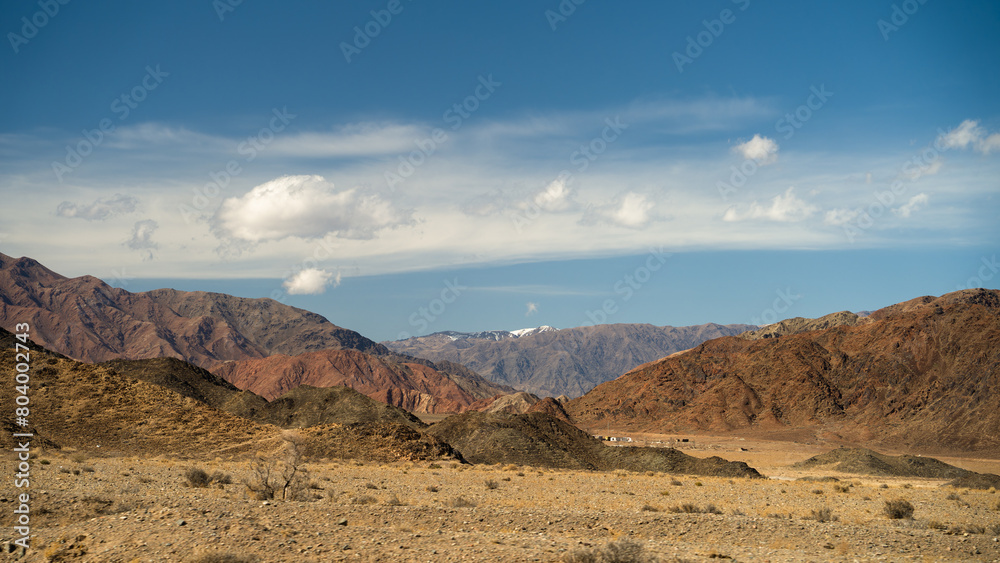 Naklejka premium the spring foothills of the snowy mountains