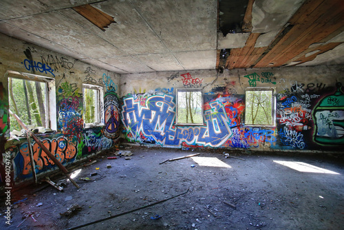 HDR shot of abandoned room vandalized and sprayed