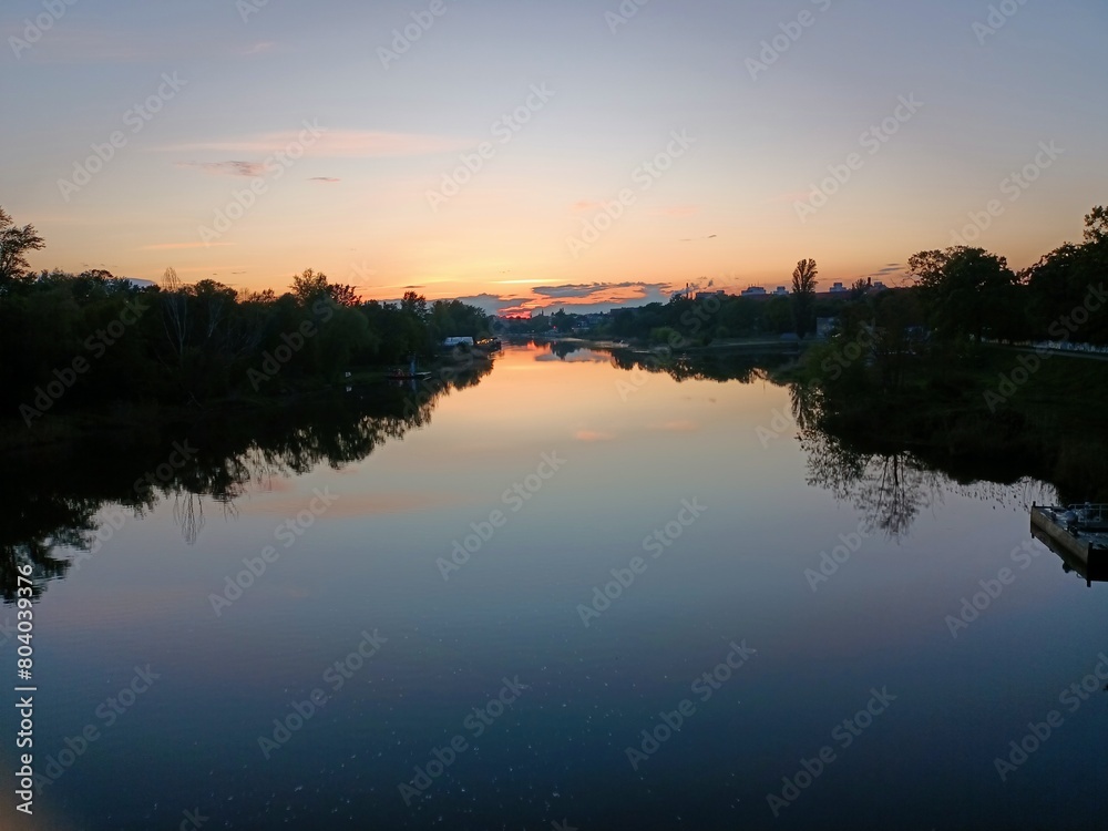 Obraz premium sunset over the river