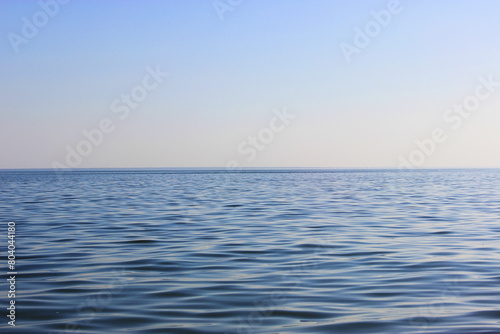 Wallpaper Mural Blue sea and blue sky, beautiful waves. View from the beach to the rocky bay Morning light over the sea in Sanremo, Beautiful landscapes. Evening sea with stones. tropical beach and blue sky backg Torontodigital.ca
