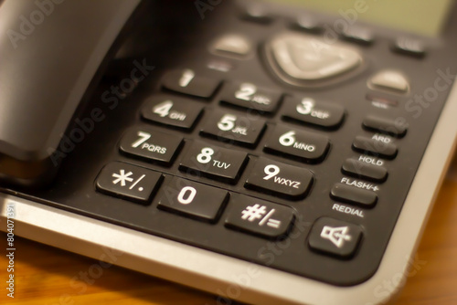 Close up soft focus on telephone devices at office desk photo