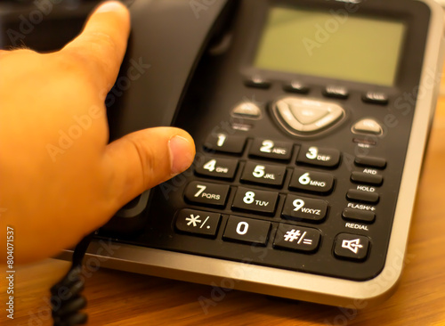 Close up soft focus on telephone devices at office desk with light effect,communication technology concept photo