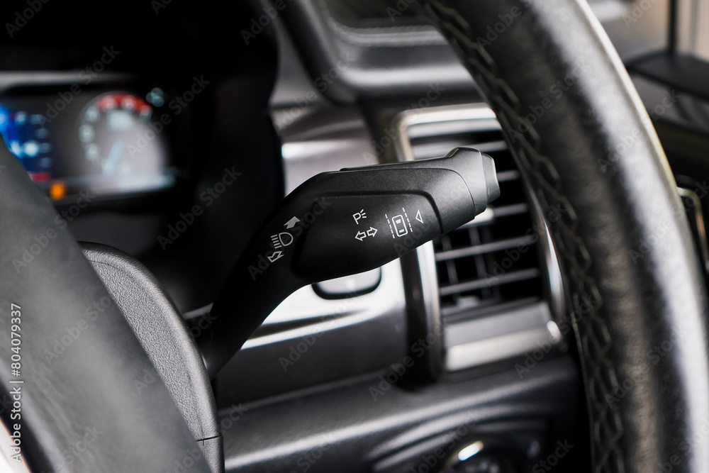 Switch off lights in a car. close-up Car integrated turning indicator with headlight switch toggle. Switch off lights in a car. close-up Car integrated turning indicator with headlight switch toggle.