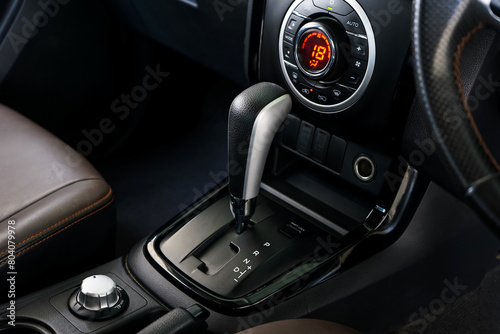 automatic transmission shift selector in the car interior. Closeup a manual shift of modern car gear shifter. 4x4 gear shift 