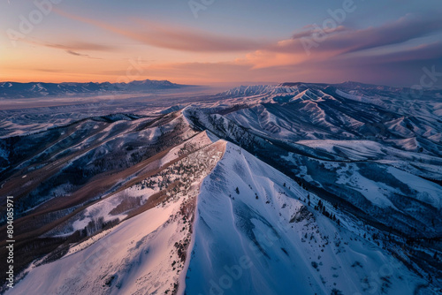 Aerial view of mountain ridge  winter during sunset 