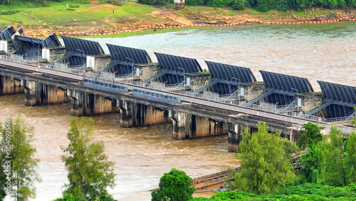 Photos Behold the grandeur of the formidable dam, its floodgates poised to tame the wild torrent below, a masterpiece of engineering imposing order upon the relentless force of nature