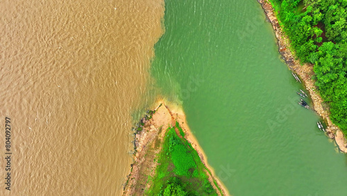 Εκτύπωση καμβά From above, the breathtaking sight unfolds: two rivers, one vivid orange, the other deep emerald green, merging harmoniously, a stunning testament to nature's artistry