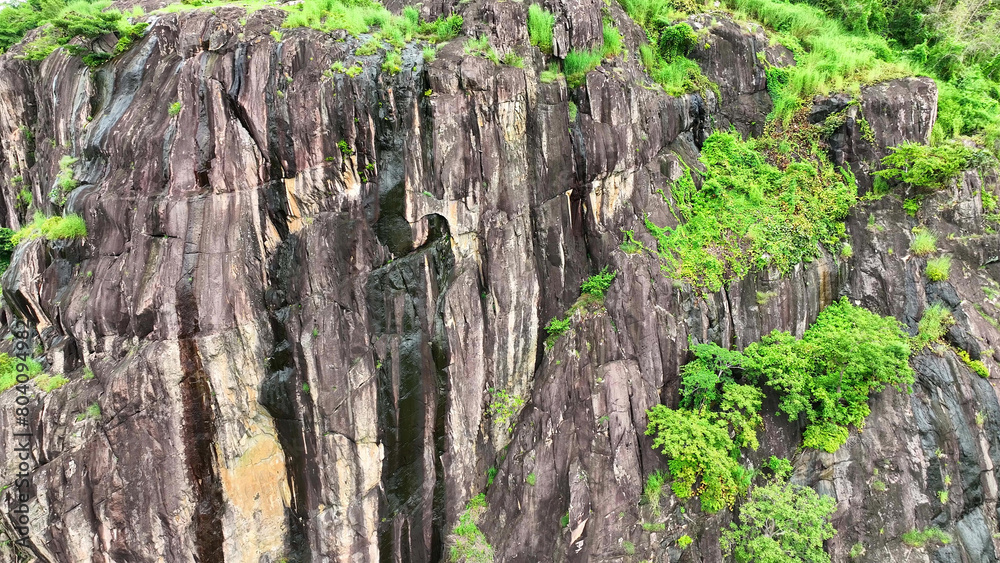 Tranquil drone flight above rocky cliffs, enveloped by a serene rainforest, an idyllic fusion of rugged landscapes and lush, untouched nature. Thailand.
Tranquil drone flight above rocky cliffs, enveloped by a serene rainforest, an idyllic fusion of rugged landscapes and lush, untouched nature. Thailand.