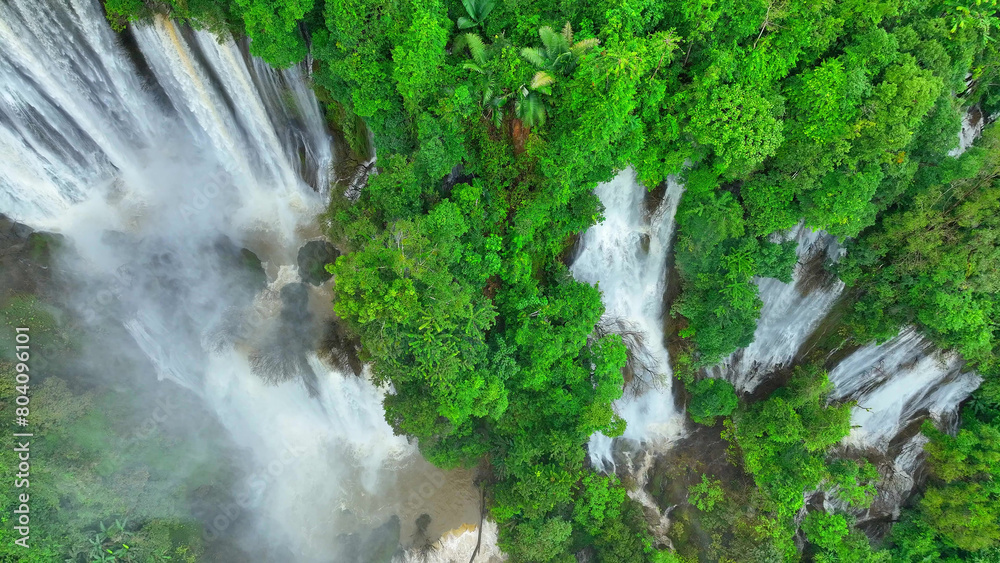 A mesmerizing secret of the rainforest, an expansive waterfall concealed within the vibrant green tapestry of the jungle. The drone's perspective unveils the majestic force of nature. Thailand.
A mesmerizing secret of the rainforest, an expansive waterfall concealed within the vibrant green tapestry of the jungle. The drone's perspective unveils the majestic force of nature. Thailand.