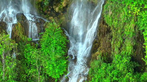 Εκτύπωση καμβά Enchanted Oasis: Behold a secret paradise within the heart of the jungle, a mesmerizing triple waterfall glistening beneath a verdant canopy, captured by drone's eye