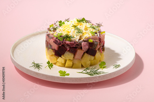 Rosolje -  Estonian beet and herring salad or Rosoli Finland salad with boiled beets, potatoes, apples, onions,  herring or other fish. Unique sweet, sour and salty flavour. Scandinavian cuisine 