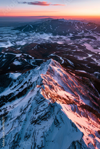 Aerial view of mountain ridge, winter during sunset 