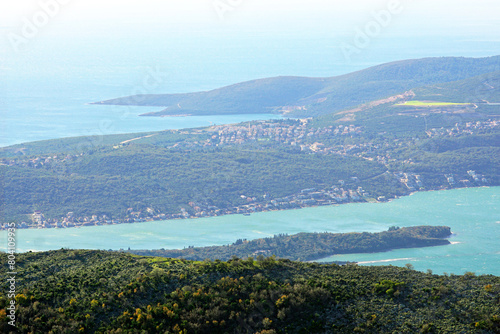 Top view of a fragment of the Montenegrin peninsula Lustica with Traste Bay and the largest island in the Bay of Kotor (St. Mark). Landscape from the top of St. Elijah on Mount Vrmac.