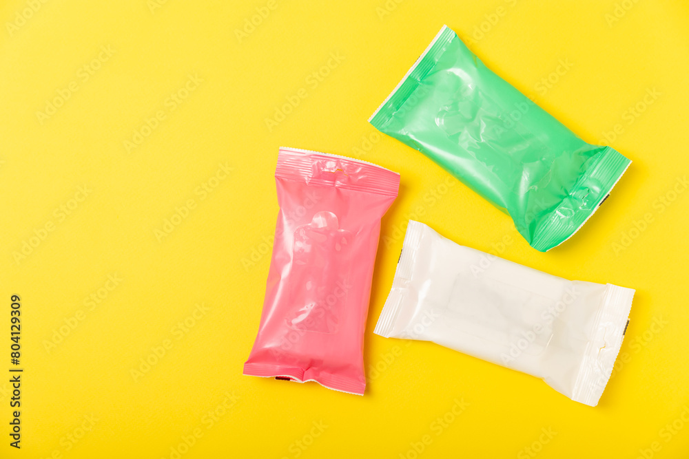 Packaging of wet wipes on background. An open pack of hand and body wipes. Mockup. A clean packet of wet wipes. Design. Place for text. Copy space. Packaging of wet wipes on background. An open pack of hand and body wipes. Mockup. A clean packet of wet wipes. Design. Place for text. Copy space.