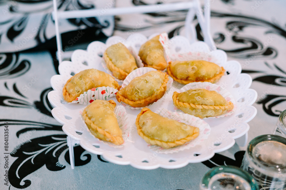 Several cookies prepared for the visitors, neatly arranged on a plate, tempting with their delightful aroma and inviting presentation. Several cookies prepared for the visitors, neatly arranged on a plate, tempting with their delightful aroma and inviting presentation.