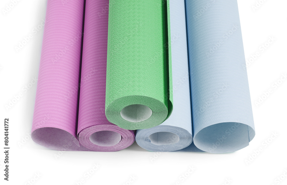 Different colorful wallpaper rolls isolated on white Different colorful wallpaper rolls isolated on white