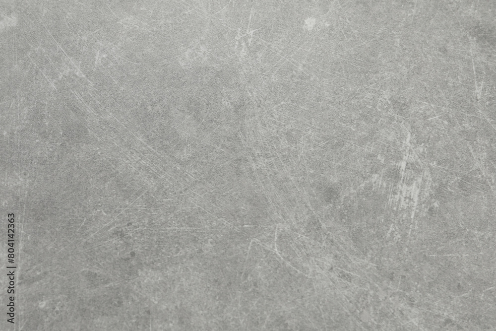 Naklejka premium Grey concrete textured surface as background, closeup