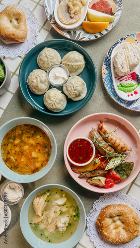 Uzbek Food  Dumplings  Soup  Salad  and Pastries on a Table