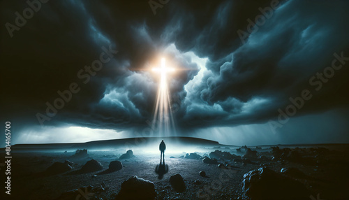 A dramatic of a person standing before a large glowing cross in a dark, stormy landscape photo