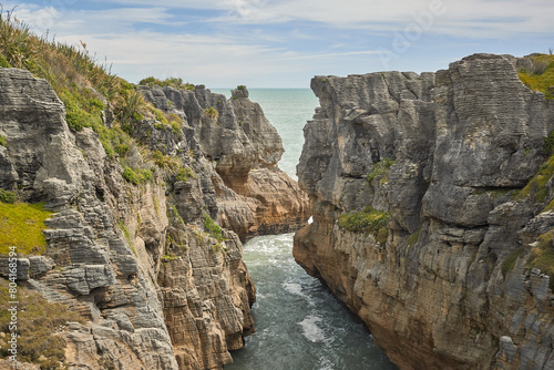 Ocean waves between rocky crags on New Zealand coast