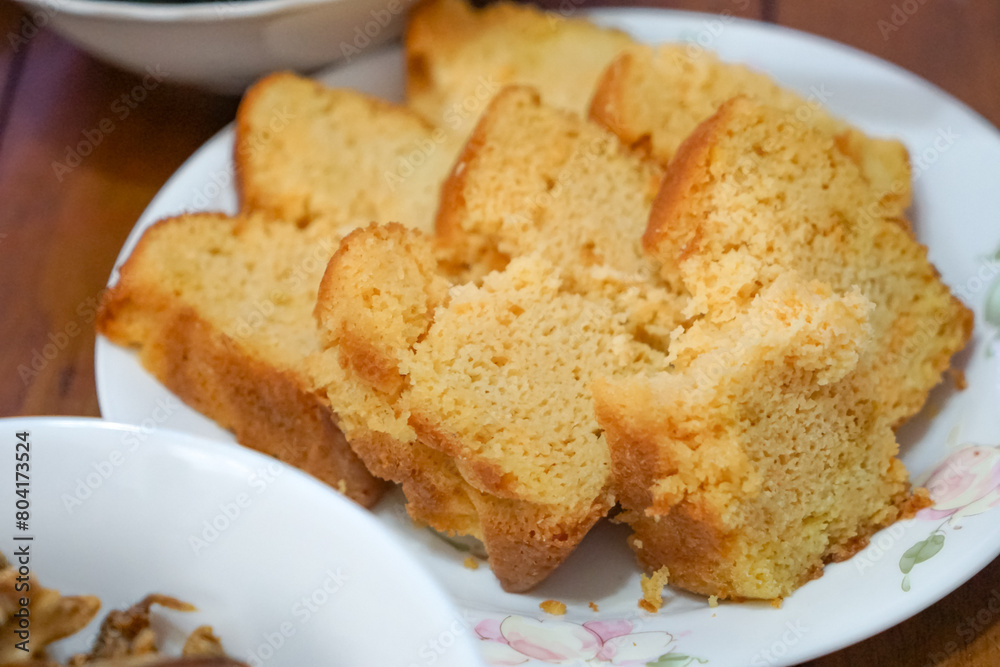 Kek mentega is a Malaysian butter cake, moist and dense, with a rich buttery flavor. It is a beloved treat often served during celebrations and gatherings. 