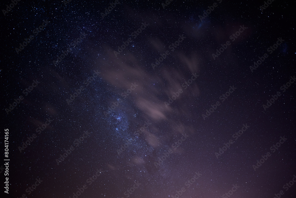 Astrophotography clusters of stars with luminous cloud cover in space