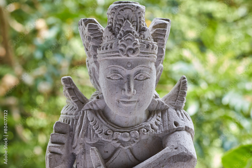Close up of stone Buddhist or Hindu statue with fine detail