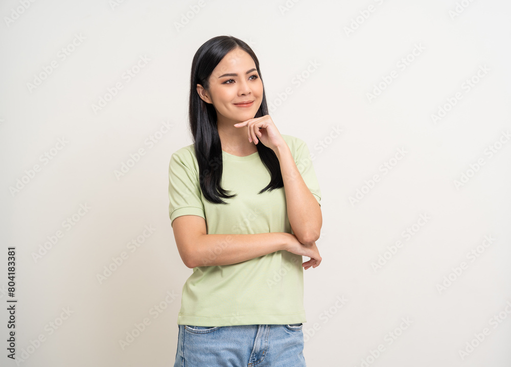Beautiful young asian woman in green shirt. Charming female lady standing pose thinking on isolated white blank background. Asian woman cute people have idea looking copy space for text advertise Beautiful young asian woman in green shirt. Charming female lady standing pose thinking on isolated white blank background. Asian woman cute people have idea looking copy space for text advertise
