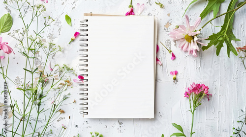 Notebook with floral decor on white background