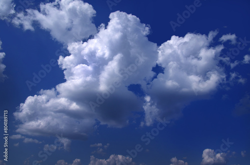 Bright blue sky, white clouds floating in the sky.