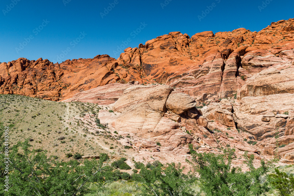 a view to the colorful red and yellow shining rock formations in the Red rock Canyon, Nevada a view to the colorful red and yellow shining rock formations in the Red rock Canyon, Nevada