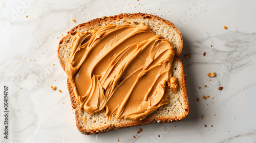 Piece of bread with tasty peanut butter on white background © Little